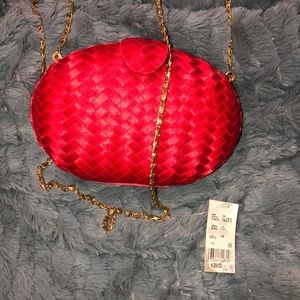 Red hard woven clutch